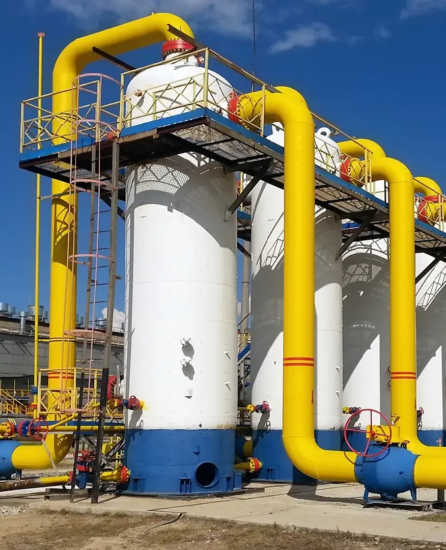 Industrial natural gas pipeline system against blue sky background, showcasing natural gas infrastructure and transportation